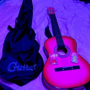 This is my pink guitar one of the strings are messed up but I have strings